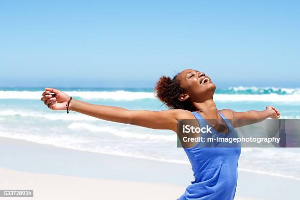 Carefree woman having a good time at beach