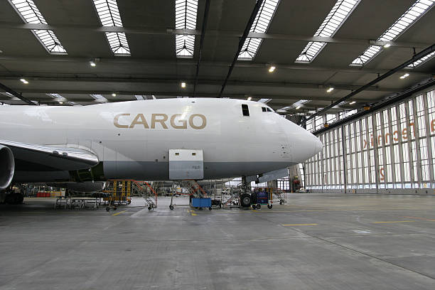 Cargo airliner in hangar stock photo