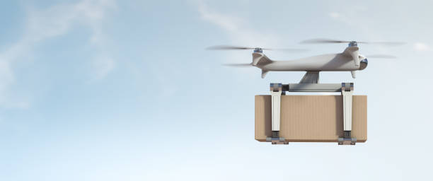 Cargo flying drone transporting a box stock photo