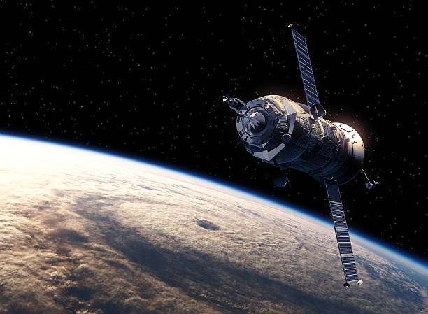 Cargo Spacecraft Orbiting Earth Cargo Spacecraft Orbiting Earth. Realistic 3D Scene. soyuz space mission stock pictures, royalty-free photos & images
