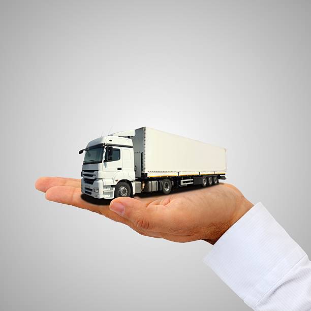 Cargo truck on the hand stock photo