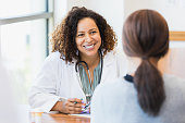 istock Caring doctor listens to patient 1342134434