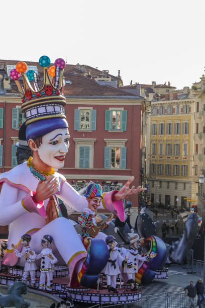 Carnaval de Nice, This years theme King of Cinema (ROI du Cinéma) -  2019: Carnaval de Nice, This years theme King of Cinema (ROI du Cinéma) - King of the Carnaval float sits above the units in Nice city stock photo