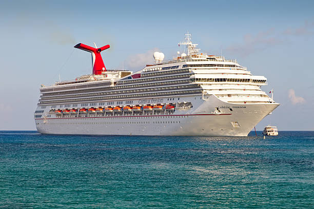 Carnival Freedom Anchored in the Cayman Islands stock photo