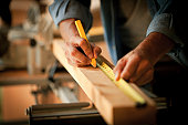 istock Carpenter Measuring a Wooden Plank 157641166