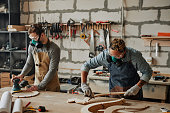 istock Carpenters Building Furniture in Workshop 1400564057