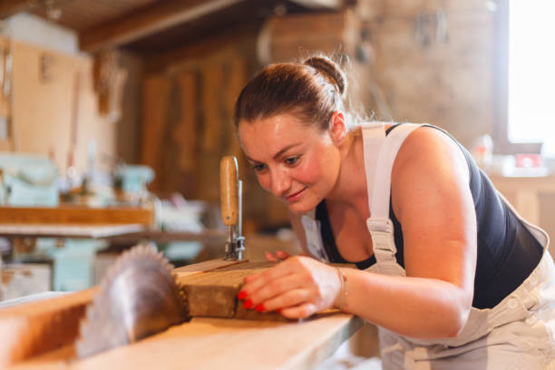 Carpenters sawing stock photo