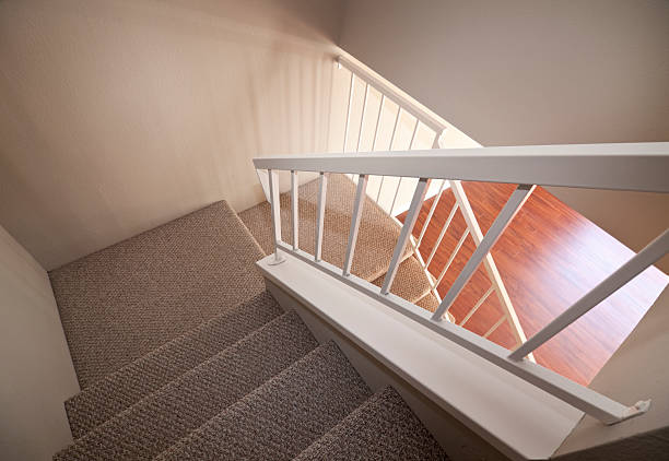 carpeted stairs in townhouse stock photo