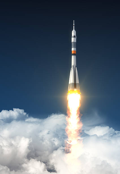 Carrier Rocket Over The Clouds Carrier Rocket Over The Clouds. 3D Scene. soyuz space mission stock pictures, royalty-free photos & images