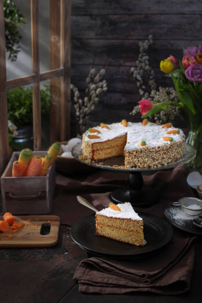 Carrot Cake in rustic barn kitchen with spring tulips for easter brunch  easter sunday stock pictures, royalty-free photos & images