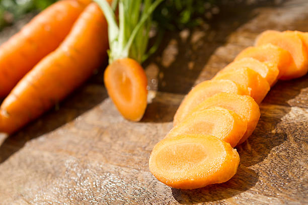 carrot on cutting board stock photo