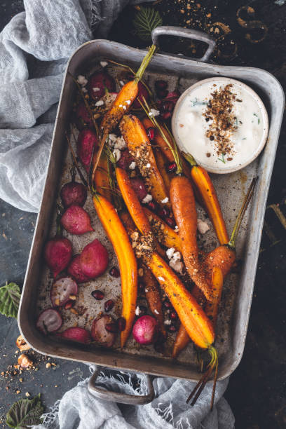 Carrots and RadishEs Roasted with Epices Dukkah, Vegetarian Dish stock photo