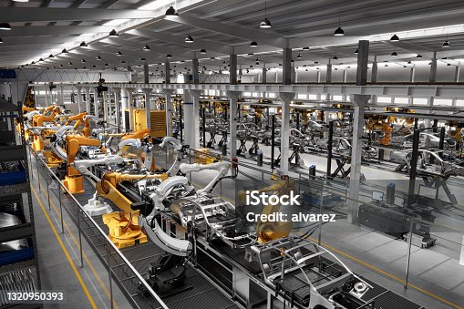 istock Cars on production line in factory 1320950393