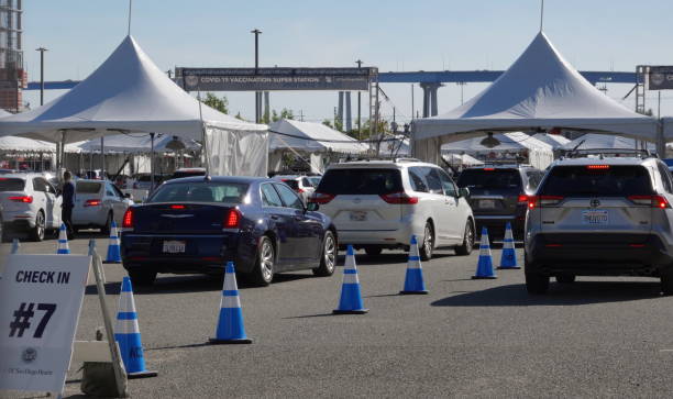 Cars queue at San Diego's Covid-19 Vaccination Super Station stock photo