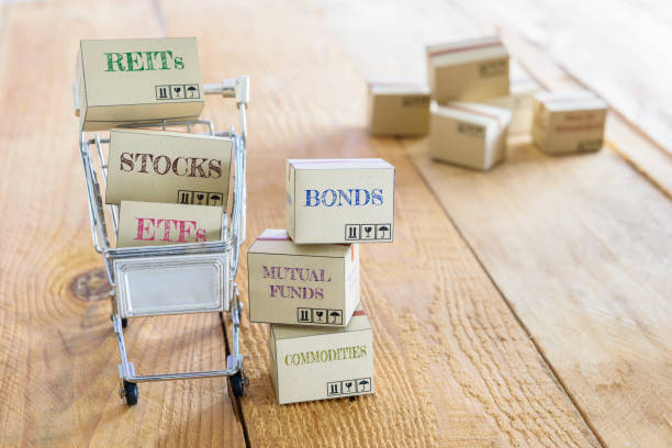 Cartons of financial investment products in a shopping cart. stock photo