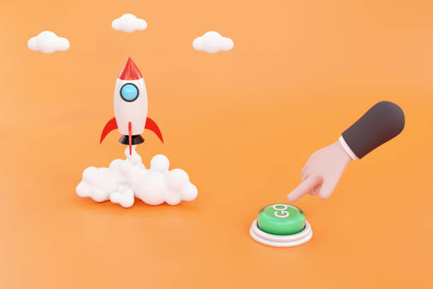 Cartoon hand presses the button and launches a rocket or spacecraft, the concept of a startup stock photo