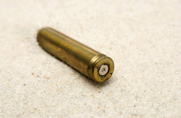cartridge on sand stock photo