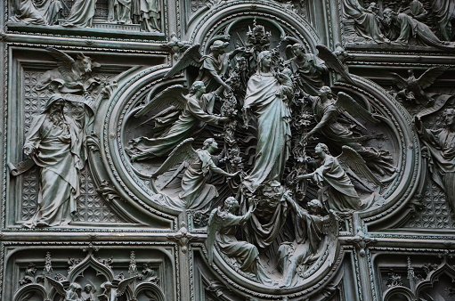 Carvings on Duomo cathedral in Milan in Italy