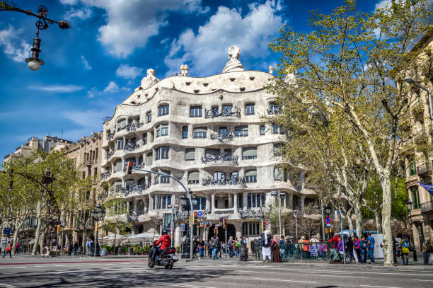 Casa Mila also known as La Pedrera Barcelona, Spain - April 3, 2018: Front view of Casa Mila, also known as La Pedrera, designed by Antonio Gaudi located on Passeig De Gracia. casa milà stock pictures, royalty-free photos & images