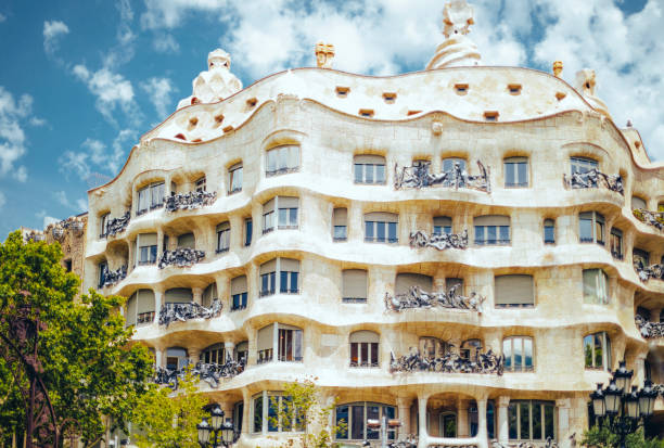 Casa Mila also known as La Pedrera Barcelona, Spain - June 26, 2017: Front view of Casa Mila designed by Antonio Gaudi located on Passeig De Gracia. casa milà stock pictures, royalty-free photos & images