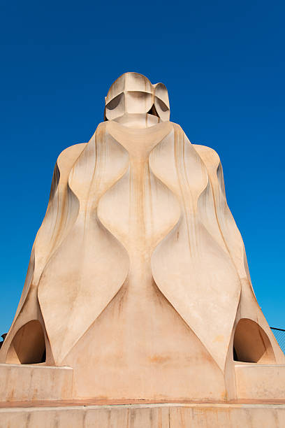 Casa Mila chimneys created by Gaudi Barcelona, Spain - July 19, 2012: Gaudi Chimneys at Casa Mila (also called La Pedrera) on July 19, 2012 in Barcelona. Terrace of the Casa Mila, with chimneys shaped anthropomorphic soldiers, created by Gaudi. casa milà stock pictures, royalty-free photos & images