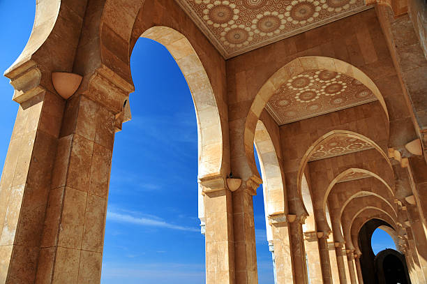 Casablanca, Morocco: Hassan II mosque - arcade Casablanca, Morocco: Hassan II mosque - arcade with carved ceiling in red Agadir marble - photo by M.Torres casablanca morocco stock pictures, royalty-free photos & images