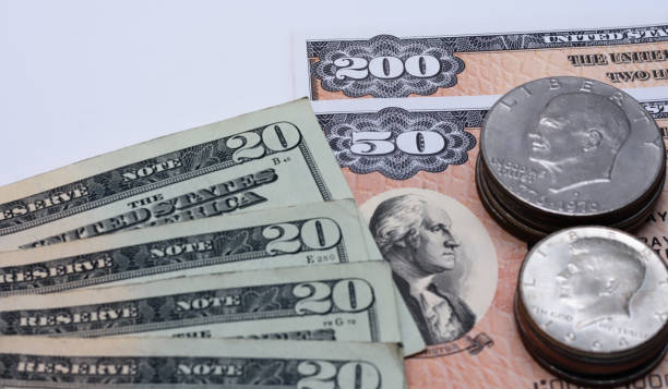 Cash, bonds or coins stock photo