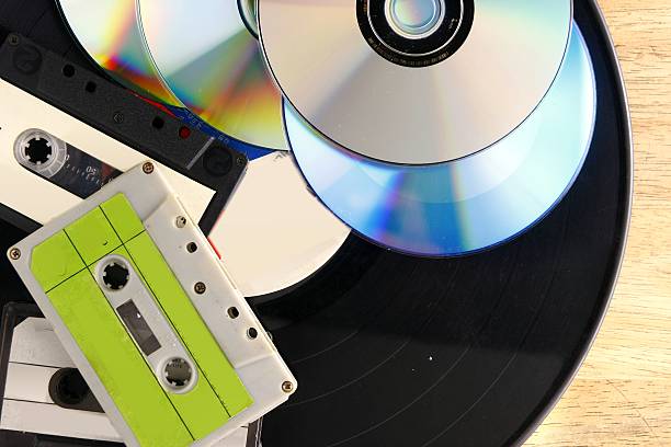 Cassette tapes, vinyl records, cd's and dvd's stock photo