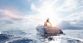 istock Catamaran motor yacht on the ocean 1323901813