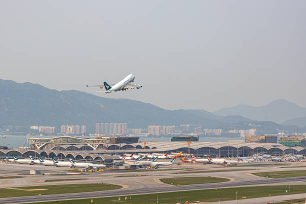 Cathay Pacific's cargo airplane is taxiing for take off at runway stock photo