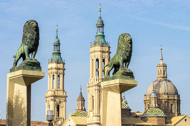 Cathedral Lady of the Pillar and two statues of lions stock photo