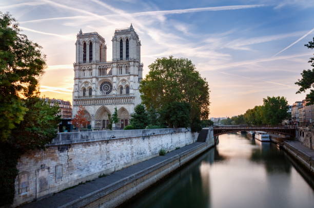 Cathedral of Notre Dame front view at dramatic dawn – Paris, France stock photo