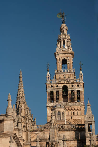Cathedral of Seville Seville Cathedral maintains in its architectural complex the old Moorish minaret tower with later Christian  additions seville cathedral stock pictures, royalty-free photos & images
