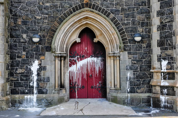 Catholic church attacked with paint and petrol bomb, Northern Ireland The door of a Roman Catholic Church suffers scorch damage from petrol bombs and paint during a sectarian attack vandalism stock pictures, royalty-free photos & images