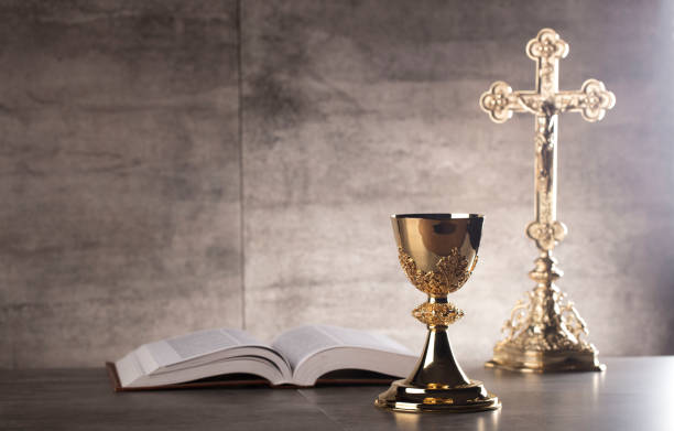 Catholic concept, gray background, place for typography. Altar cross, gray stone background chalice photos stock pictures, royalty-free photos & images