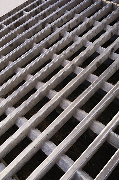 Cattle Grid Close-up of steel cattle grid.See more images of Backgrounds Patterns Textures here: cattle grid stock pictures, royalty-free photos & images