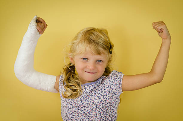 caucasian girl with bandage on hand stock photo