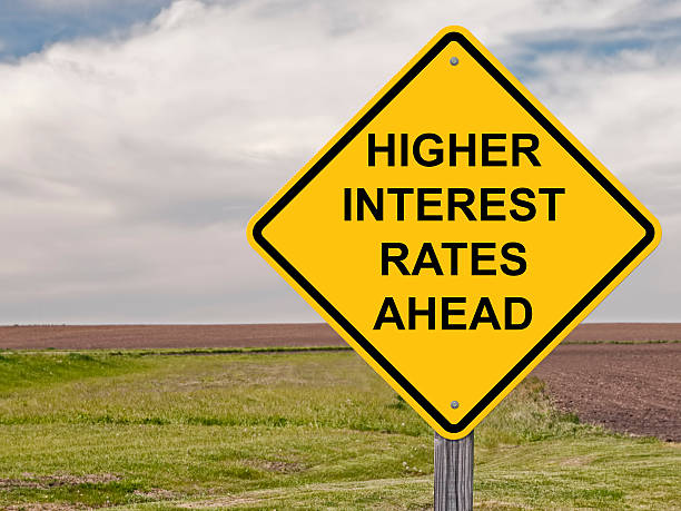 Caution - Higher Interest Rates Ahead Caution Sign - Higher Interest Rates Ahead high up stock pictures, royalty-free photos & images