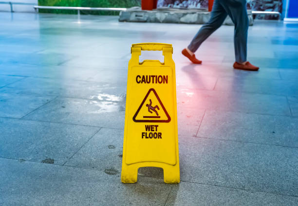 Caution wet floor Caution wet floor slip and fall stock pictures, royalty-free photos & images