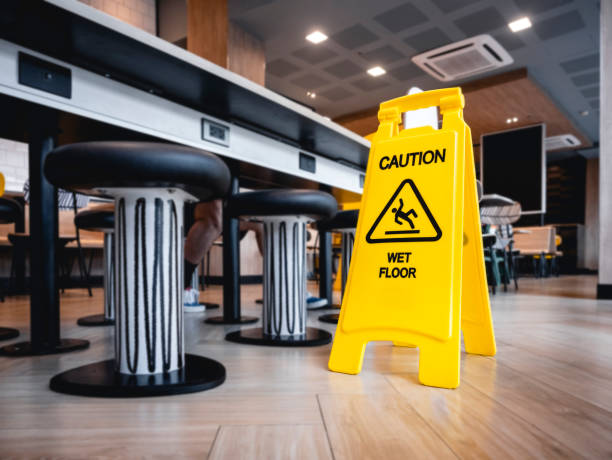 Caution Wet floor signage stand indoor Building stock photo