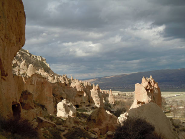 Cave dwellings of early Christians in Cappadocia on a cloudy day stock photo