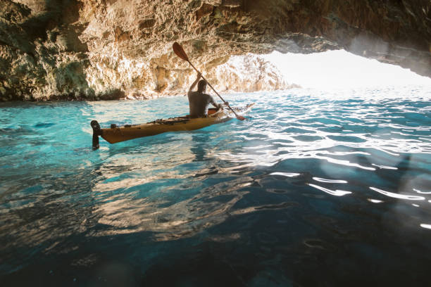 Cave kayaking stock photo