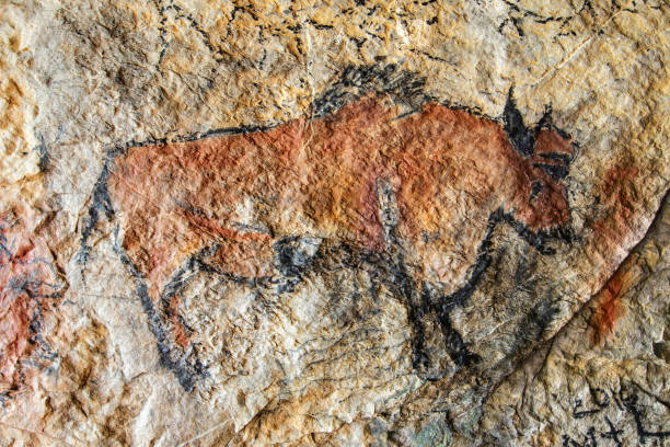 Cave painting in prehistoric style stock photo