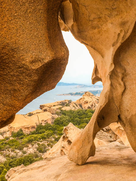 cave rocks with sea view on Sardinia stock photo