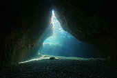Cave underwater natural sunbeams Mediterranean sea