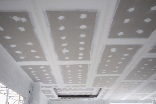 Ceiling Gypsum Board Installation At Construction Site Ceiling Gypsum Board Installation At Construction Site