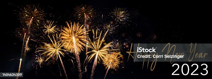 istock HAPPY NEW YEAR 2023 - Celebration New Year's Eve, Silvester 2023 holiday background panorama greeting card - Goldeen firework fireworks pyrotechnics on dark night sky 1404634309