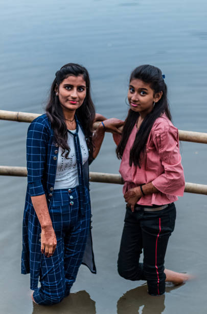 Celebration of Chath Puja Ghaziabad, Uttar Pradesh/India - Nov 2019 : Girls enjoying the festival of Chhath Puja in the river bank of Hindon chhath stock pictures, royalty-free photos & images