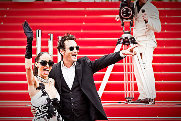 celebrity couple on red carpet in cannes - cannes stok fotoğraflar ve resimler