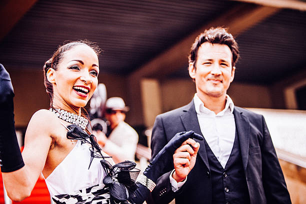 Celebrity couple on red carpet in Cannes Celebrity couple on red carpet in Cannes.  actress stock pictures, royalty-free photos & images